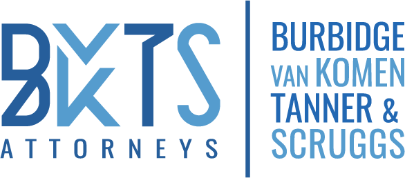 Burbidge, Van Komen, Tanner & Scruggs, LLC Logo in various shades of blue